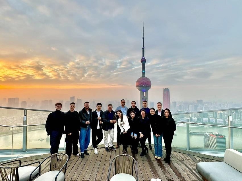 China business tours cohort at sunset on the Bund, Shanghai