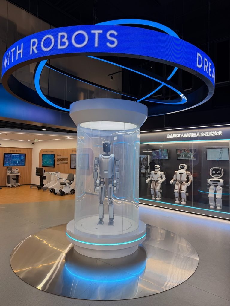 Humanoid robots in a Chinese robotics company's exhibition hall, seen on a China investor tour